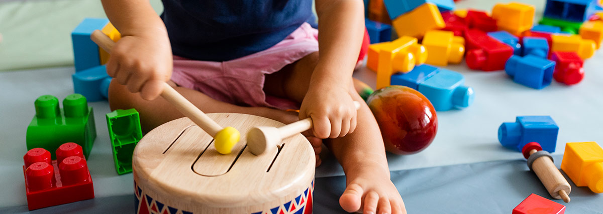 Little boy playing percussion